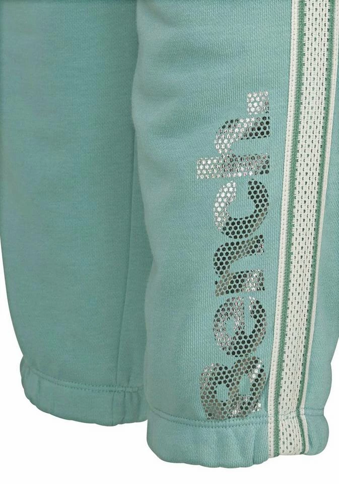 Bench. Relaxhose mit gestreiftem Bund und Glanzprint Grau-meliert, Mint, Apricot 4 Bench. Relaxhose mit gestreiftem Bund und Glanzprint Grau-meliert, Mint, Apricot – Bild 4